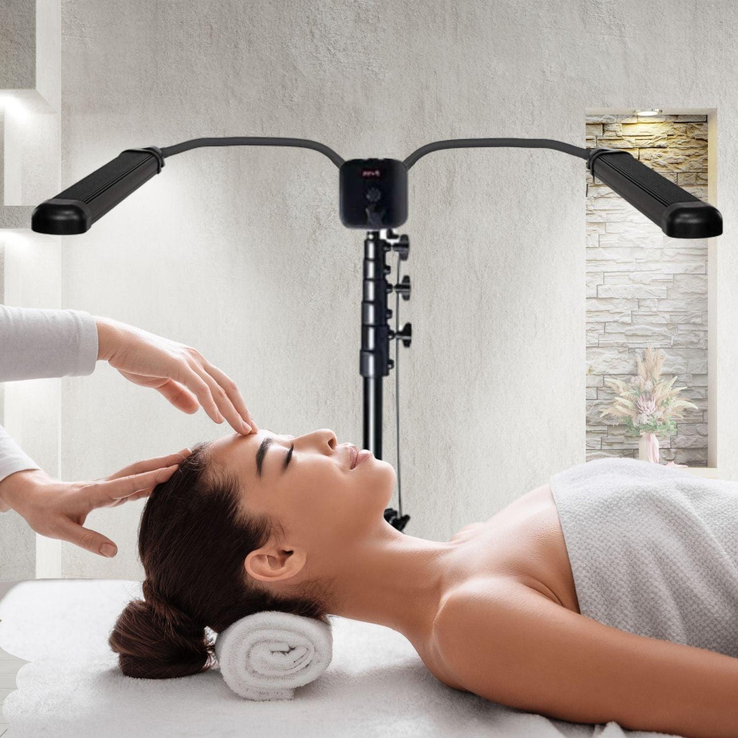 Face therapist use dual arm light to her client
