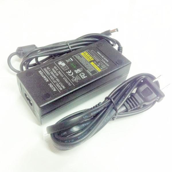 Side view of AC adapter brick and cable