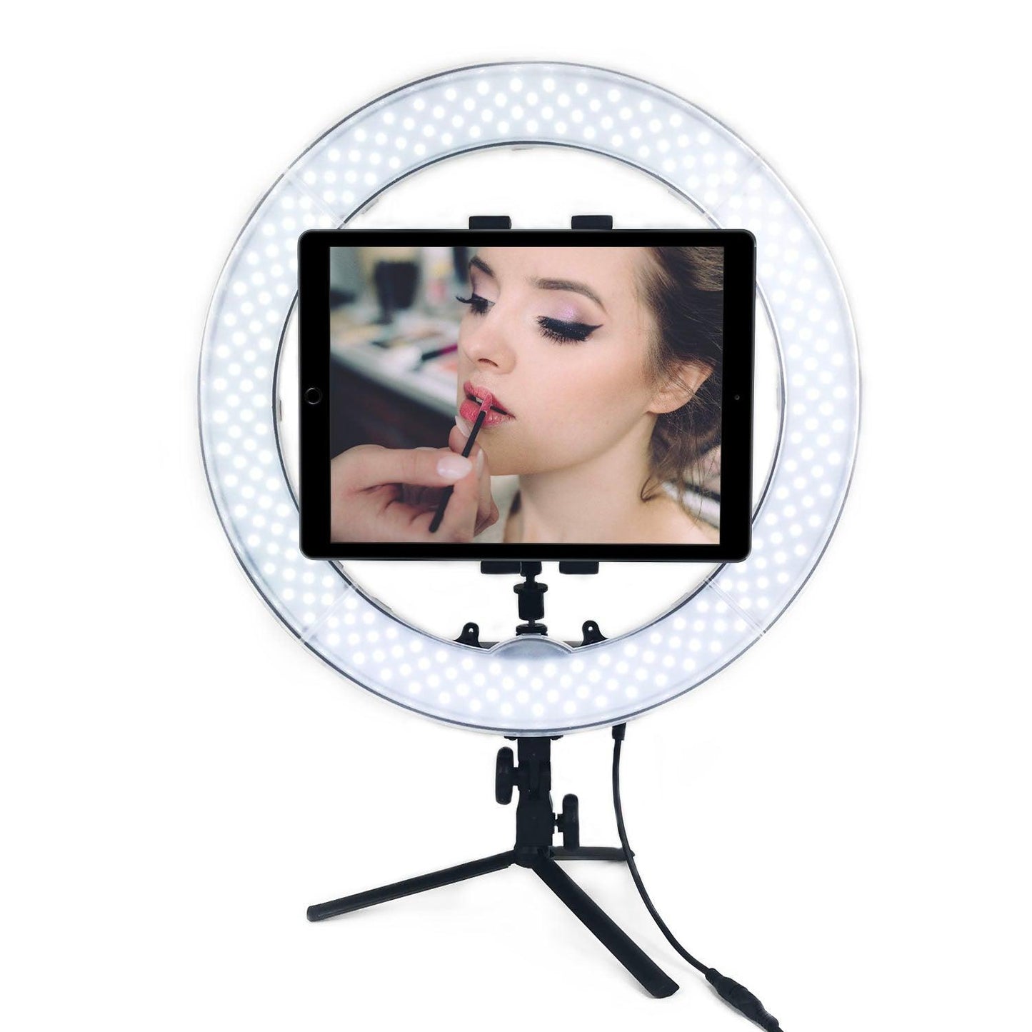 Woman applying makeup with iPad in Ring light
