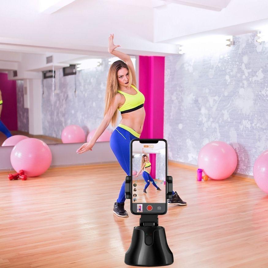 A dancer use 360 Auto Face Tracker Phone Holder in recording dance step