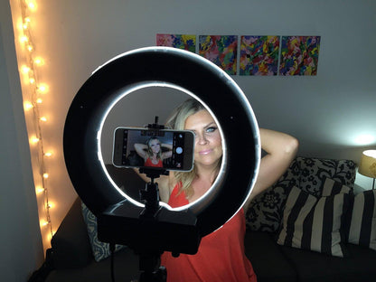 Millennial taking a selfie using ring light