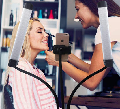 Woman applying makeup to client at a salon