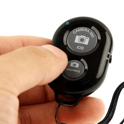 Holding iPhone Bluetooth Camera Shutter Remote